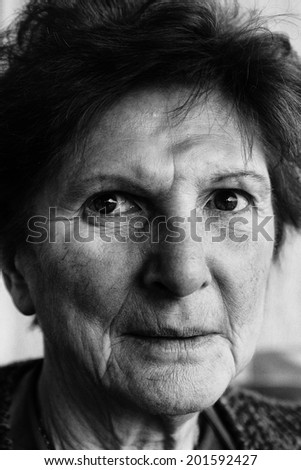 Portrait of elderly woman in black and white