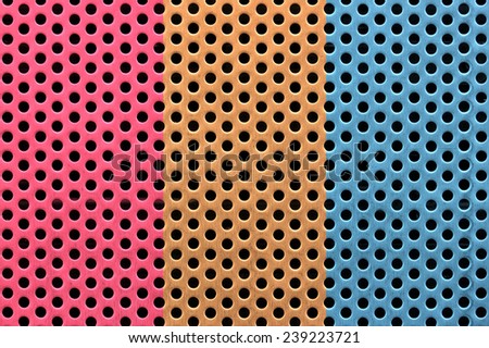Colorful painted metal sheet perforated with round holes