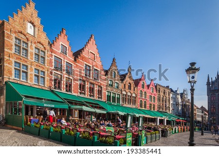 BRUGES, BELGIUM - April 5: View of the colorful medieval-looking houses on the Market Square on April 5, 2014 in Bruges, Belgium