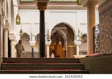 MOROCCO, FEZ - DECEMBER 24: worshipers in Zawiya Moulay Idriss II on December 24, 2014 in Fez, Morocco. In Fez area, Zawiya are are burial sites of sultans and holy men and may also include a mosques.