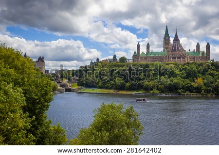 View of Parliament Hill, with the, Library of Parliament, the Peace Tower and the Parliament Buildings, the Locks of the Rideau Canal, the Fairmount Chateau and the Ottawa River in Ottawa, Canada.