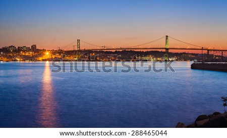 View of the Angus L. Macdonald Bridge at twilight. The bridge connects downtown Halifax with Dartmouth. Halifax, Nova Scotia, Canada.