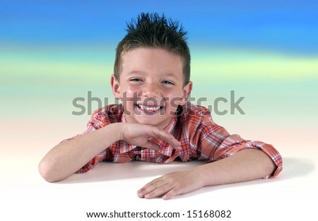 smiling funny child whit hair crest on sky and clouds background