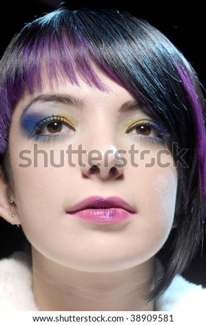 blue and purple makeup. and yellow lue makeup