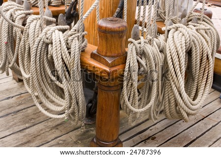 close up of rope thats been tied off on a ships deck