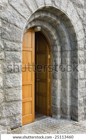 old and heavy church door that is open