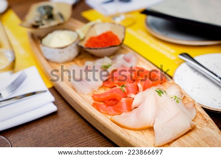 Selection of fish including soft-salted pike perch, sea trout, smoked butterfish, salmon caviar, lamprey