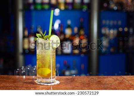 Glass of mojito on marble bar stand