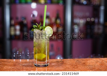 Glass of mojito on marble bar stand