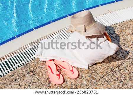 Concept of beach accessories near the pool