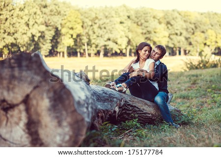 young couple in love walks in nature on a sunny day