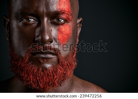 Red beard man studio portrait on dark background