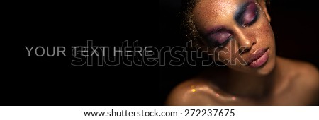 portrait of a beautiful black woman with art make up