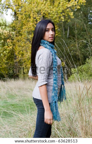 Pretty ethnic girl enjoying the fall season.