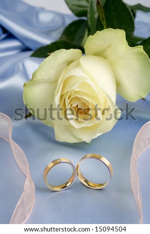 stock photo Wedding rings on a blue background