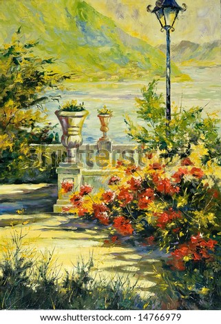 Terrace with flowers and a lantern on coast of lake