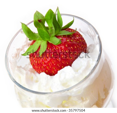 Strawberry in a glass with whipped cream
