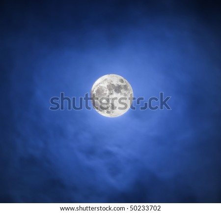 The moon in the dark blue night sky