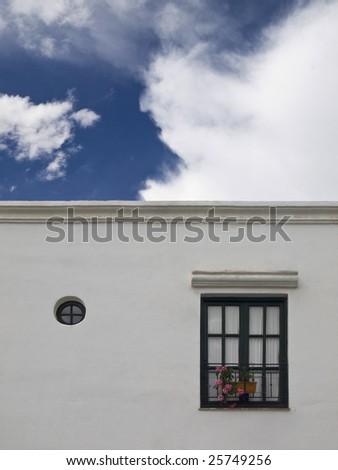 Facade of a white simple mediterranean house.