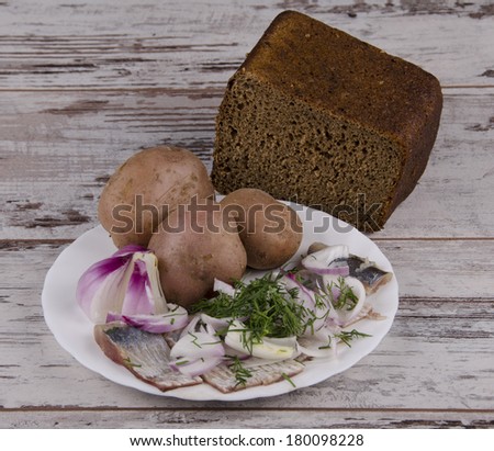 salted fish with onions and potatoes