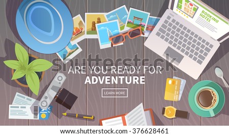 Flat vector web banner on the theme of travel , vacation, adventure. Preparing for your journey. Outfit of modern traveler. Objects on wooden background. Top view. Are you ready for Adventure #1