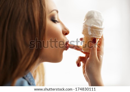gorgeous girl with ice cream, in jeans jacket