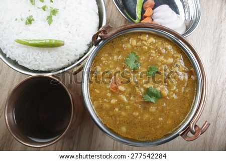 Mixed dal made of boiled lentils cooked with fresh Indian spices and tadka (tempering) of tomatoes, curd and butter