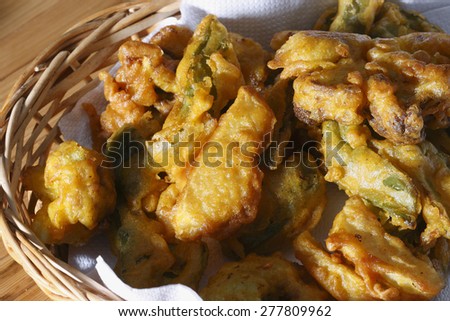 Vegetable fritters are a popular snack all over India, Pakistan and Afghanistan. It is made from frying vegetables dipped in gram flour batter