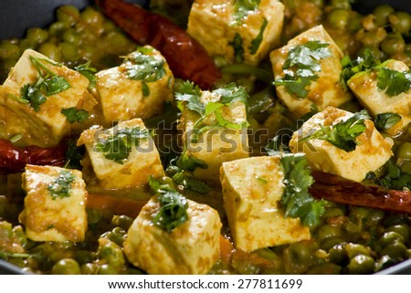 Mattar Paneer  is a north Indian dish consisting of Paneer,the Indian cottage cheese and peas in a slightly sweet  spicy sauce.