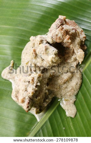 Mutton curry served on banana leaf