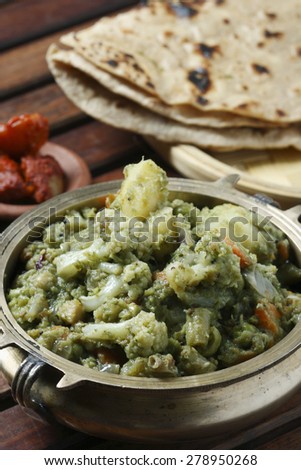 Vegetables kurma from India in which carrots, beans, potatoes cooked in coriander and coconut paste served with roti.