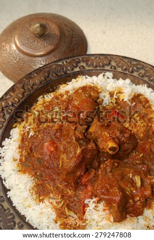 Rogan josh made of lamb or goat cooked in tomatoes, oil and fresh spices