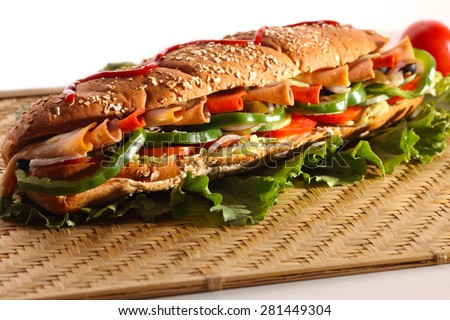 Chicken and Turkey Ham Sandwich with vegetables, brown bread with sesame seeds