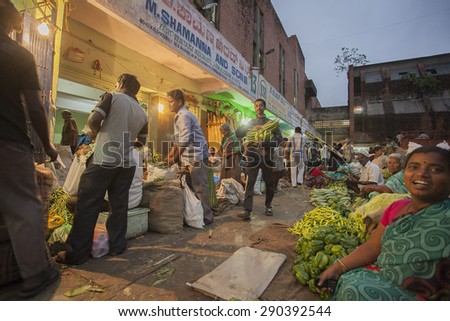 BANGALORE, INDIA - May 27, 2014: vendors have just set up their stalls and start selling vegetables at dawn in the busy city market