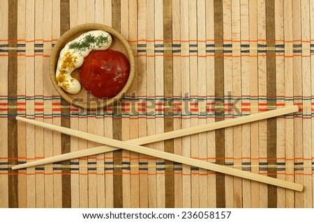 Chinese sticks from a bamboo for a meal on the wattled mat