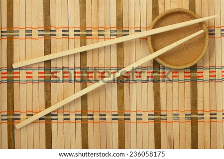 Chinese sticks from a bamboo for a meal on the wattled mat
