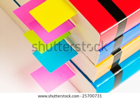 Stack of books with tab organizers