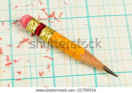 Stubby pencil on accounting ledger paper