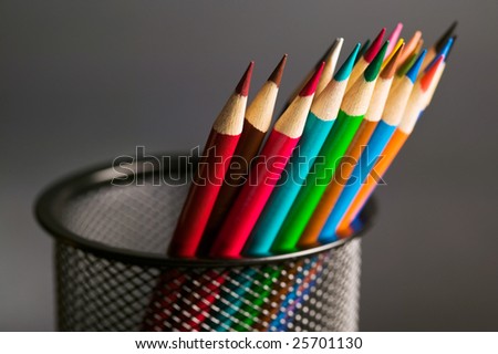Colored pencil crayons in a pencil cup