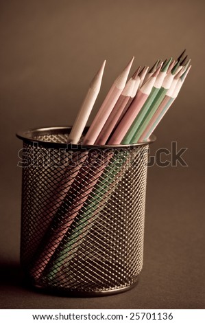 Colored pencil crayons in a pencil cup