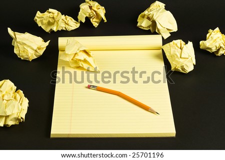 Crumpled paper and broken pencil