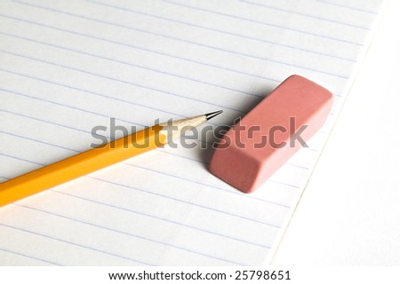 Pencil and eraser on a lined pad of paper