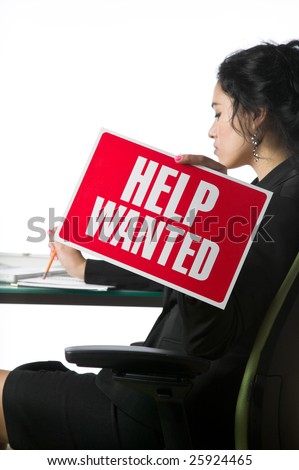 Pretty young businesswoman with a Help Wanted sign