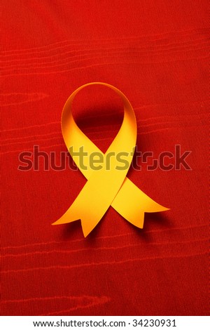 AIDS awareness ribbon isolated against textured satin cloth