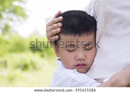 little Boy hugging his mother