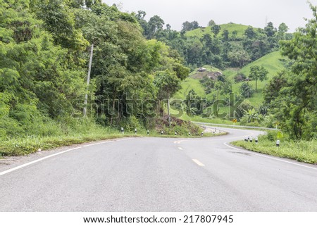 Road uphill path with many curves to driving with caution.