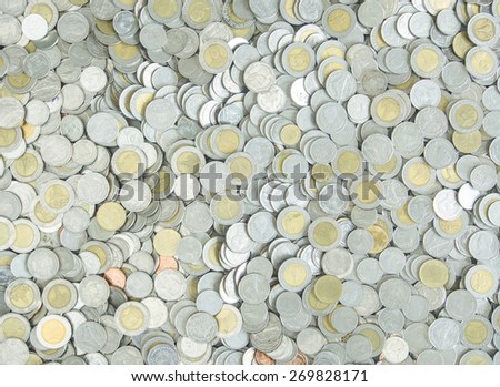 Silver metal coins used to cover the background.