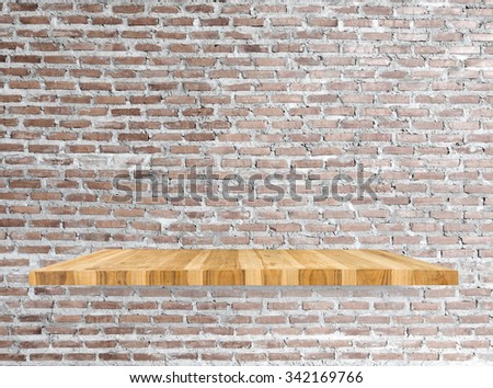 Empty top wooden shelves and brick wall vintage background. For product display and advertising and promotional purposes.