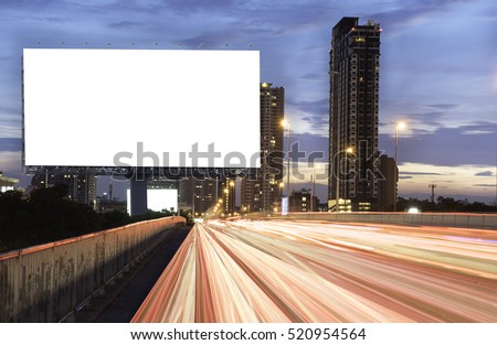 Billboard mockup outdoors, Outdoor advertising poster at night time with street light line for advertisement street city night. With clipping path on screen