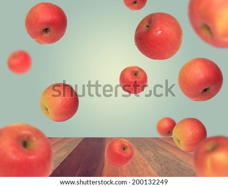 Red Gala apple floating on a white background